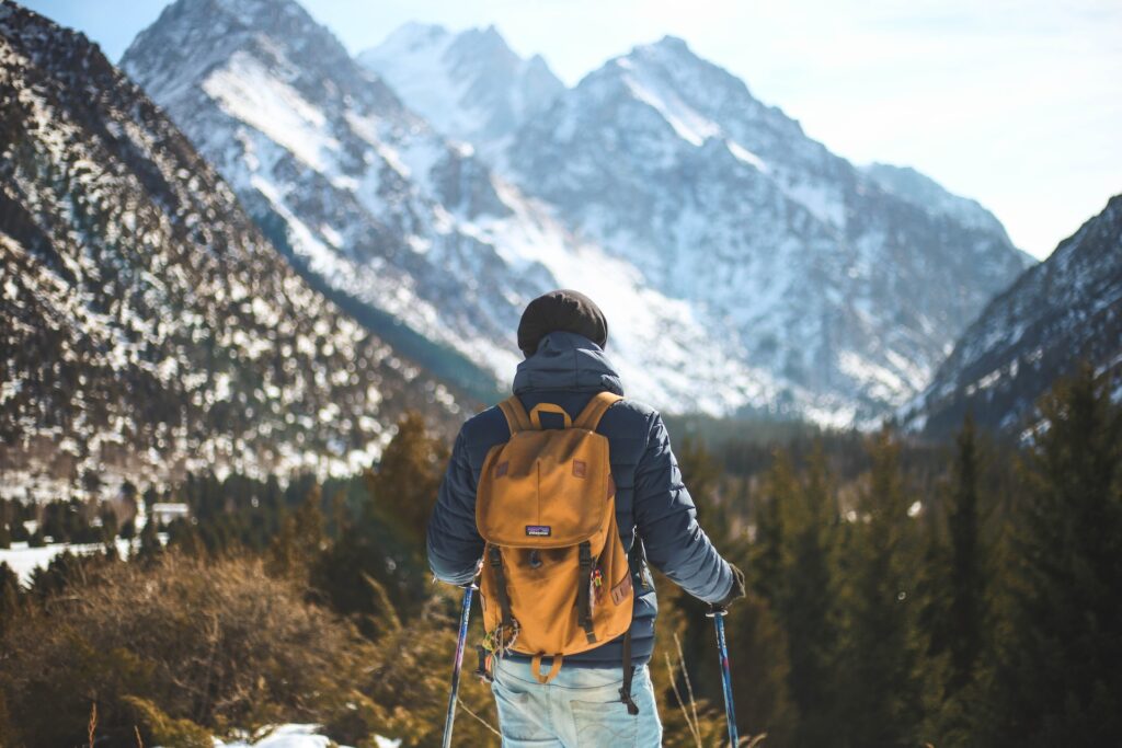 Man hiking in the mountains to stay active to stop weekends ruining his diet.